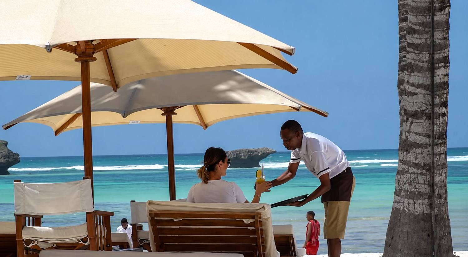 Sunbeds and umbrellas on the white sand