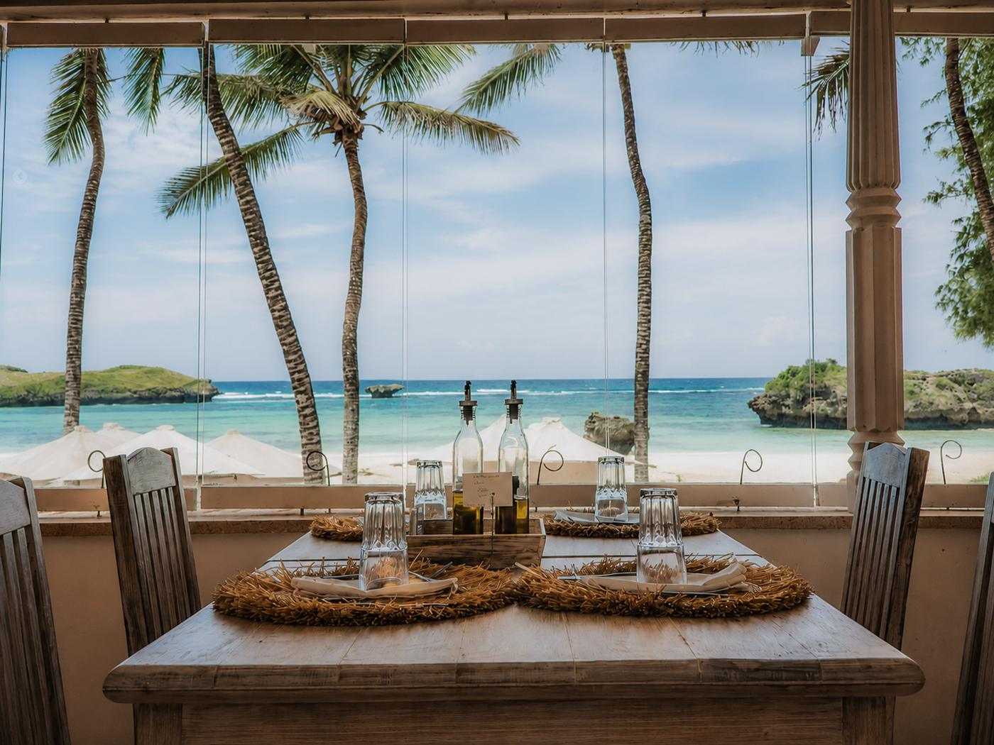 Lunch table set in front of the lagoon